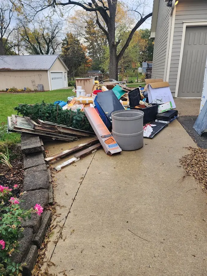 Dumpster being loaded with debris for Estate Cleanout Dumpster Rental in Oakley